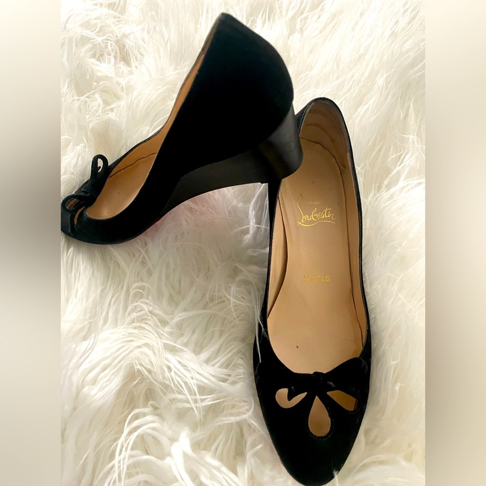 Classy Christian Louboutin black suede wedges.